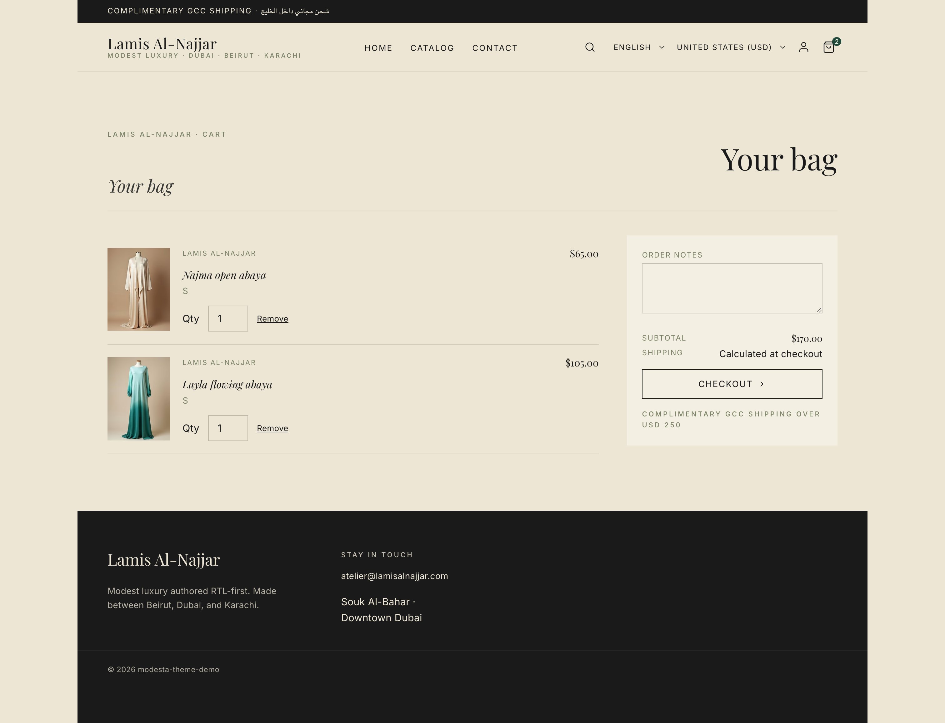 Page-style cart with two items, dual-script header, modest card thumbnails, and GCC shipping note